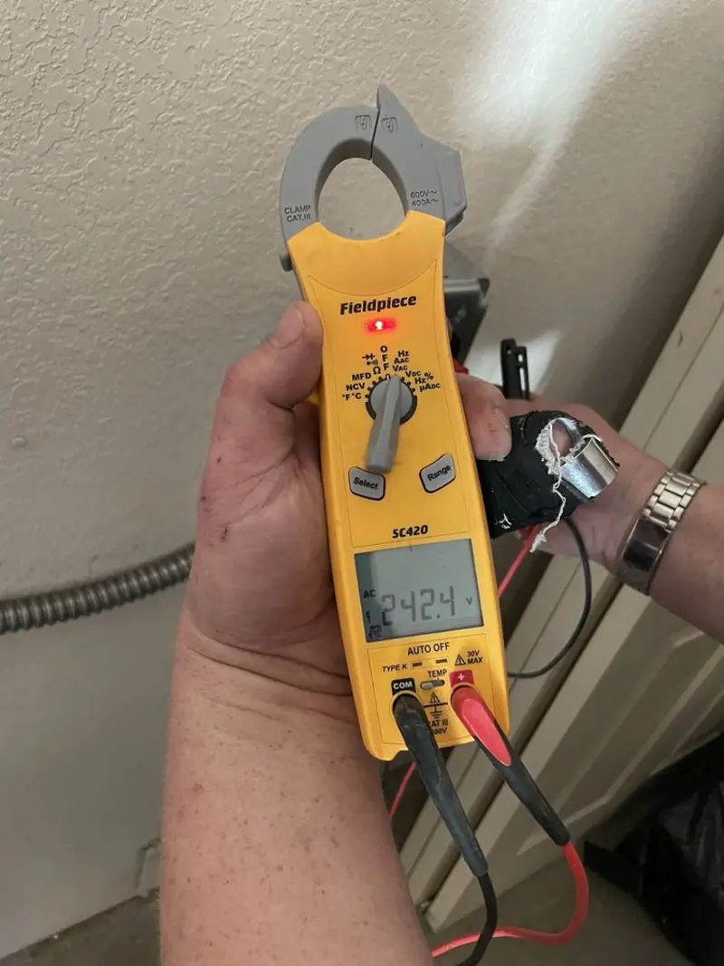 Voltage testing with clamp meter during Electrical Installation Services in Allen